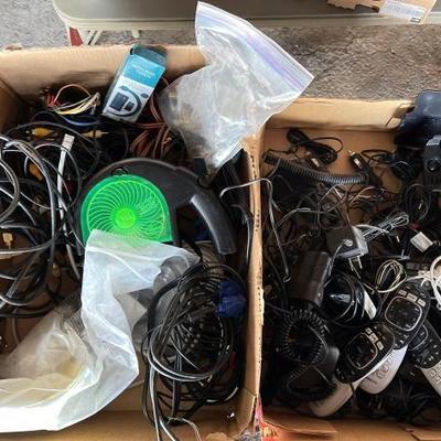 #10568 â€¢ (2) Boxes of Phone Chargers, Direct Tv Remotes, Tv Cables, CD & DVD Repair Device
