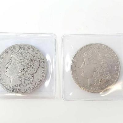 #668 â€¢ (2) 1884 & 1921 Morgan Silver Dollars
