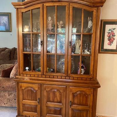 Full China cabinet with angel figurines 