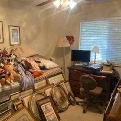 assorted framed art, small desk, daybed, dresser