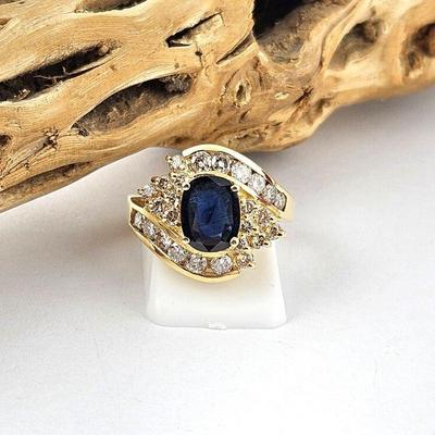 Lot #SB 314 - Beautiful Sapphire and Diamond Ring in a 14k Gold Ring (Size 7.5) 1.08 Carat Dark Oval Cut Sapphire 