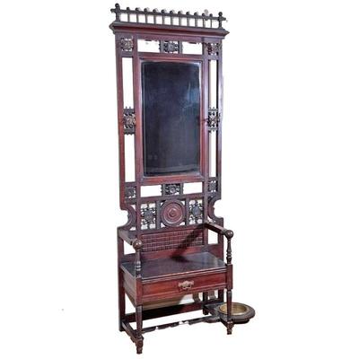 AESTHETIC PERIOD CARVED HALL TREE | Having four cast brass hooks beveled, mirrored back seat with single drawer and umbrella stand with...