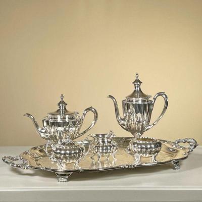 HEIRLOOM MELON SILVERPLATE COFFEE & TEA SERVICE | Including your coffee pot, a teapot, covered sugar, open creamer, a waste bowl, and a...