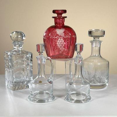 (4PC) CUT CRYSTAL & GLASS DECANTERS | Including square decanter signed â€œRogushaâ€ on the bottom, round decanter with sandblasted...