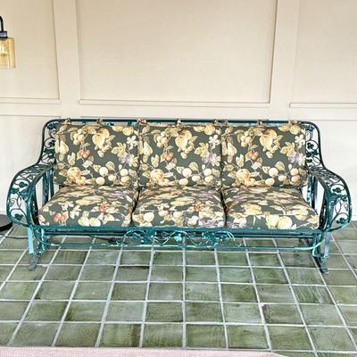 THREE CUSHION PORCH GLIDER | 3 cushion outdoor couch/sofa with wrought iron viney pattern mounted on articulating arms allowing the couch...