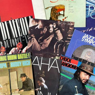 (10PC) JAZZ & WORLDLY MUSIC VINYL RECORDS | Including; Al Di Meola, Pablo Cruise, various jazz artists and albums, and flamenco and other...