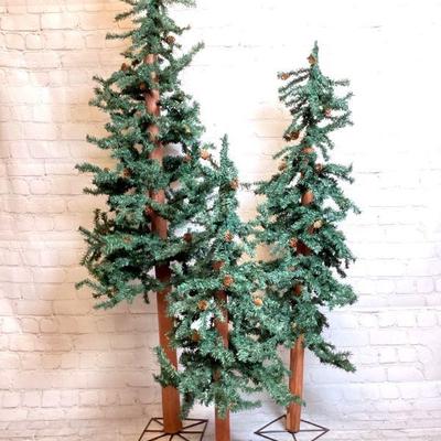 JSHI919 Christmas Tree Trio	3 natural style Â fir trees with fir cones and metal bases. Â Small, medium, and large

