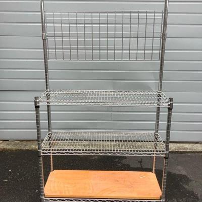 REEM236 Stainless Storage Rack	Gardner rack style. All shelves are adjustable. Metal rack. Needs cleaning. Sturdy wood plank, can go on...