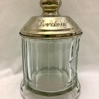 JOSW204 Bordenâ€™s Antique Jar	Antique Malted Milk glass container. The lid as a few dents on the very top.
