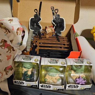 Toy saddles, farm toys and baby Yodas