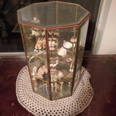#9060 • Display Case With Carved Figurines, Pendants, and More!