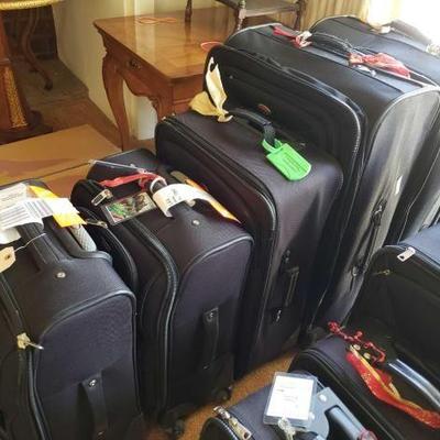 #12064 • 5 American Tourister Suit Cases