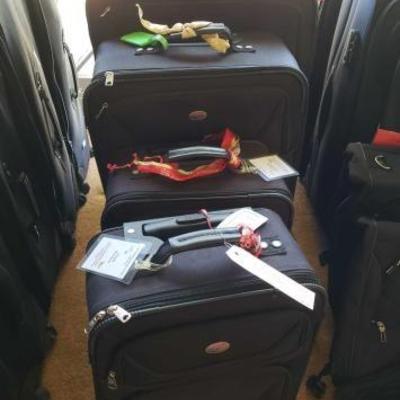 #12062 • 5 American Tourister Suit Cases