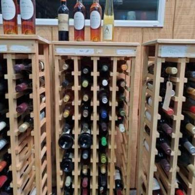 #1072 â€¢ Collection of Sealed Bottles on Rack
