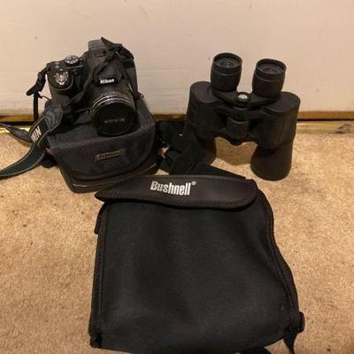 #10582 â€¢ Nikon CoolPix Camera with Case, Emerson Binoculars and Busnell Binoculars
