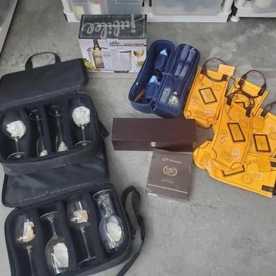#1012 â€¢ 5 Wine Bags, Wine Cooler/Ice Bucket Combo, 2 Wine Travel Sets, 2 Ridel Wine Glass Sets, Oro Tubo Natural 6 Cigars
d