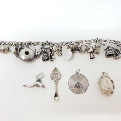 #725 â€¢ Sterling Silver Charm Bracelet And 4 Sterling Silver Pendants
