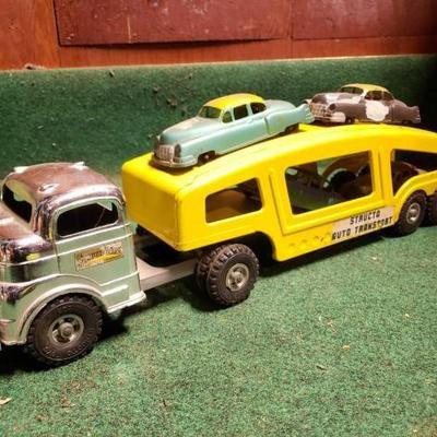 #8582 â€¢ Vintage Structo Truck and Structo Auto Transport Trailer with 4 Cars
