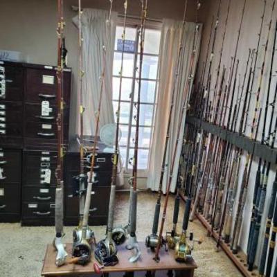 #2318 • 11 Fishing Poles with 7 Reels