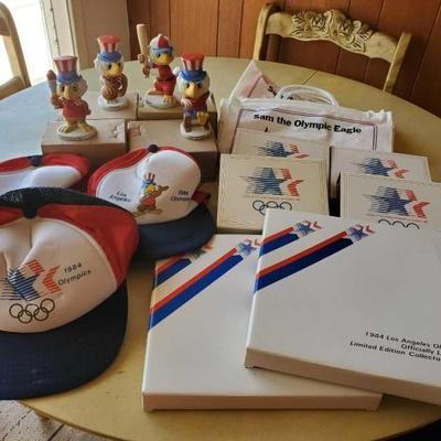 #8038 â€¢ 3 Olympic Hats, 4 Sam The Olympic Eagles, 2 LA Olympics Collectors Plates, 4 Ceramic Picture Frames
