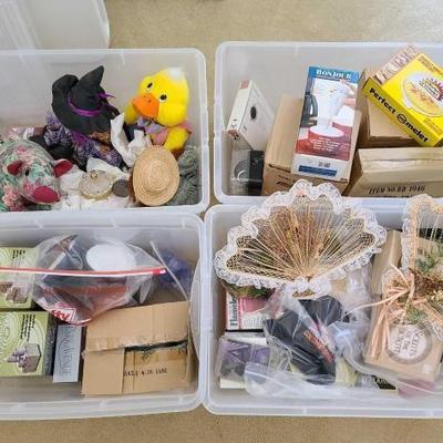 #9548 • 4 Totes of Stuffed Decorations, Flameless Candles, Wall Decor and More