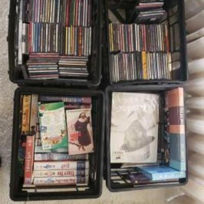 #2460 â€¢ 4 Totes of VHS, DVDs, and CDs
