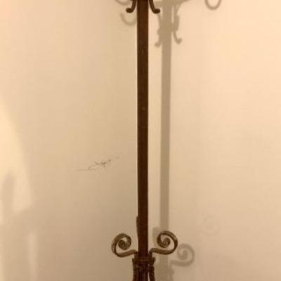 Very nice antique wrought iron coat rack/ hall tree. This has a funky rusted patina w/ traces of old paint. 6 ft. tall