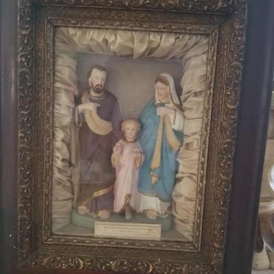 Antique religious home altar of the Holy family confraternity in an ornate wooden frame