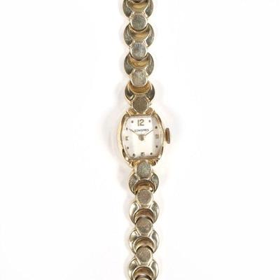 LONGINES 14K GOLD LADY'S WRISTWATCH | on a bracelet of hollow textured links, marked 