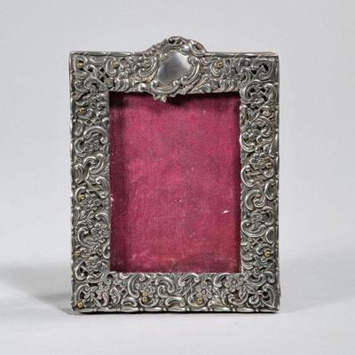 STERLING PICTURE FRAME | Sterling silver repousse picture frame, insert 2.75 x 3.75 in. - w. 4.5 x h. 6 in. (overall)

