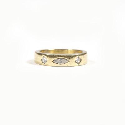 SAM LEHR DIAMOND & 18K GOLD RING | Mounted with a marquise diamond and two 1/4 carat diamonds, sizing buttons. size 7, 7.3g
