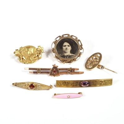 (7pc) ANTIQUE 14K GOLD PINS | a 1908 bar pin with amethyst cabochon, an art nouveau pin with a portrait of a woman (1-1/8 in.), two bar...