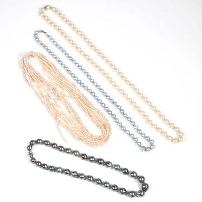 (4pc) MISC. PEARL NECKLACES | Including a strand of knotted off-white pearls (9.8mm, 30 in.); a strand of blue baroque pearls with a 14k...