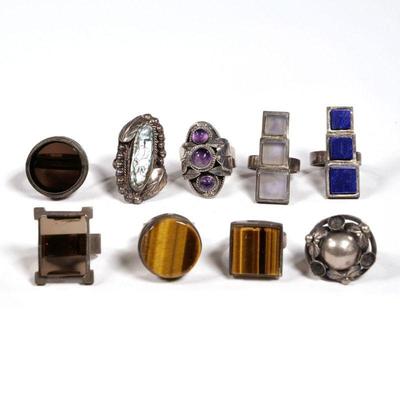 (9pc) STERLING SILVER RINGS | Including a Mexican Taxco de los Ballestros ring with three amethyst cabochons, the central stone fixed to...