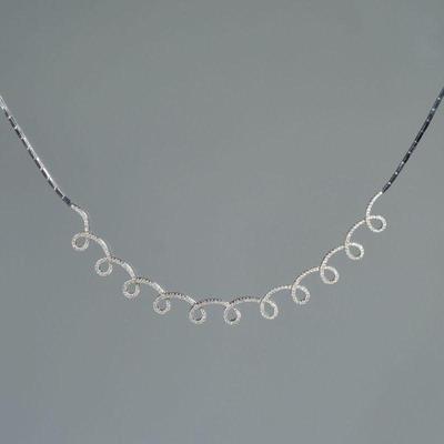 DIAMOND & 18K WHITE GOLD SPIRAL LINE NECKLACE | having eleven articulating loops mounting a continuous line of melee diamonds set in 18k...