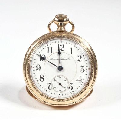 HAMPDEN DUEBER GOLD FILLED WATCH | Pocket watch having a gold-filled case with engraved steam engine train on the back, marked inside,...