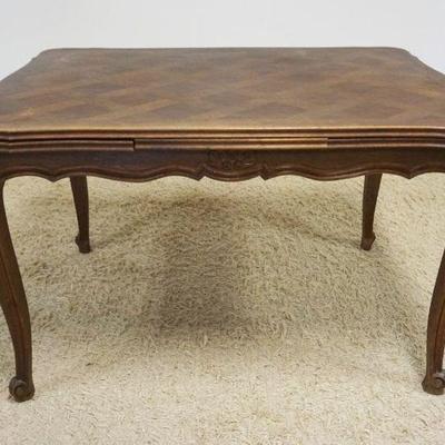 1168	FRENCH PROVINCIAL OAK PARQUET TOP TABLE W/PULL OUT LEAVES, APPROXIMATELY OPEN 78 IN X 36 IN X 29 IN, CLOSED 47 IN
