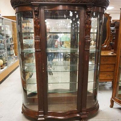 1211	HEAVILY CARVED SERPENTINE FRONT OAK CHINA CLOSET W/WINGED GRIFFINS & PAW FEET, APPROXIMATELY 54 IN X 19 IN X 70 IN HIGH
