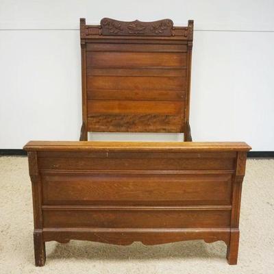 1198	ANTIQUE OAK BED W/CARVED CREST HEADBOARD, APRROXIMATELY 54 IN INNER X 75 IN HIGH
