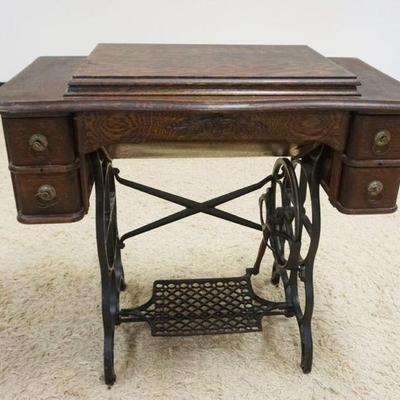 1187	UNIQUE OAK TREADLE SEWING MACHINE, APPROXIMATELY 34 IN X 18 IN X 31 IN
