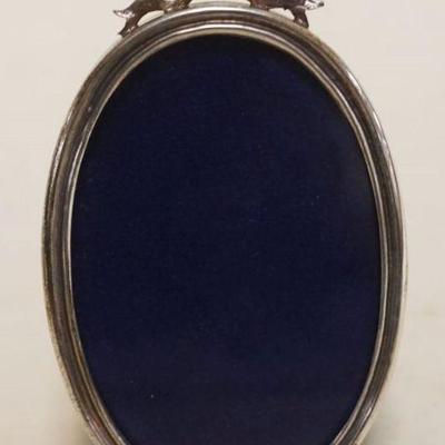 1065	CARTIER STERLING OVAL FRAME, APPROXIMATELY 4 IN HIGH
