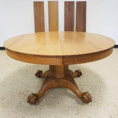 1179	54 INCH SOLID ROUND OAK TABLE W/FLUTED COLUMN & BALL & CLAW FEET, 4-11 INCH LEAVES
