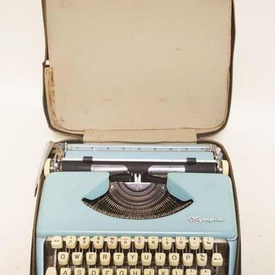 1306	OLYMPIA TYPEWRITER, APPROXIMATELY 12 IN X 13 IN X 4 IN
