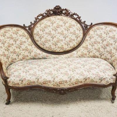 1172	WALNUT VICTORIAN MEDALION BACK UPHOLSTERED SOFA W/HEAVILY CARVED CREST, APPROXIMATELY 71 IN X 44 IN HIGH, STAINING ON UPHOLSTERY

