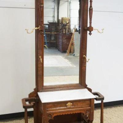 1181	EASTLAKE WALNUT VICTORIAN MARBLE TOP HALL RACK W/MIRROR BACK & ONE DRAWER, APPROXIMATELY 38 IN X 13 IN X 87 IN HIGH
