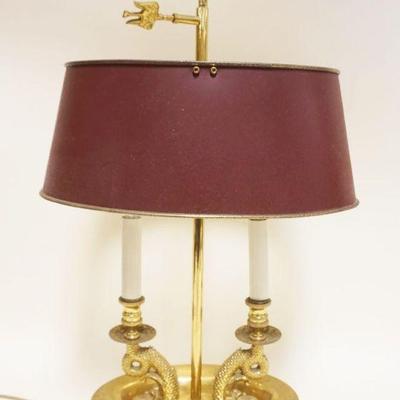 1035	SOLID BRASS HEAVY DOUBLE DOLPHIN BOUILLOTTE LAMP W/ADJUSTIBLE RED TOLE SHADE, APPROXIMATELY 23 IN HIGH
