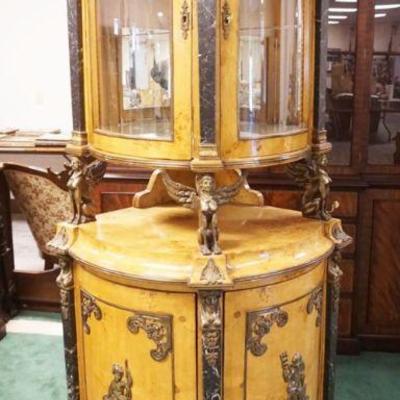 1182	EGYPTIAN REVIVAL 2 PART CORNER CABINET W/MARBLE & ORNATE METAL MOUNT, SOME MIRROR LOSS TO INTERIOR, APPROXIMATELY 27 IN X 80 IN HIGH

