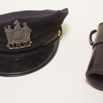 1245	ANTIQUE POLICE HAT W/EMBLEM & LEATHER HOLSTER
