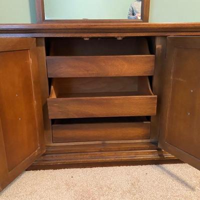 Inside of 9-drawer dresser with attached mirror 