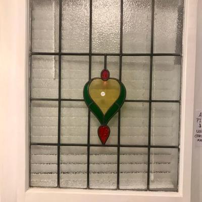 Antique stained glass window hanging.